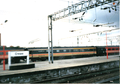 A picture of a Virgin Trains' MK 3 carriage at Crewe station in the year 2000. It is in its former Intercity livery.