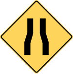 Road narrows.