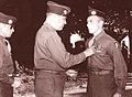 General March presents Pvt Milo Huempfner, 551st Parachute Infantry Regiment, with the Distinguished Service Cross in June, 1945 for his action during the Battle of the Bulge.