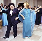 Ford dancing with comedian Marty Allen in the Entrance Hall of the White House of the White House during a September 21, 1976 state dinner in honor Liberian President William Tolbert