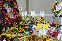 Portrait and other tributes, including mural and messages from 650 Spanish fans, letters, pictures, teddy bears, and flowers.