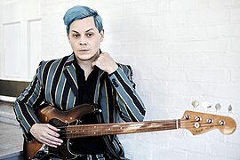 Singer Jack White wearing striped Madcap England blazer, 2021.