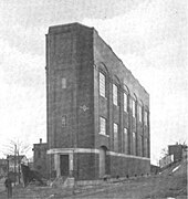 A three-story wedge-shaped building