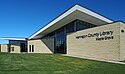 Maple Grove branch, a modern cream-colored building.