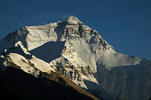 A color photo of a mountain covered in snow