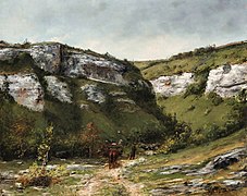 Voyageur suivi de son âne chargé, dans une vallée de montagne, signé « G. Courbet ».