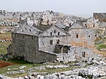 Ruins of a stone church without roof.