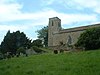 A plain stone church with a small west tower