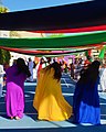 Image 13Women flip their hair sideways and wear brightly coloured traditional dress while performing an Emirati folk dance. (from Culture of the United Arab Emirates)