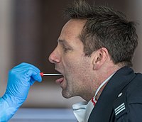 Demonstration of a throat swab for COVID-19 testing