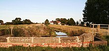 small brick parapet bridge over the stream