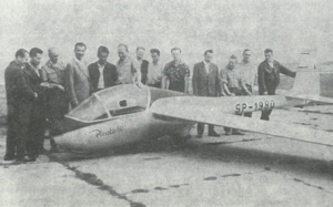 picture of the glider with some people in the background