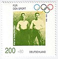 האתלטים אלפרד וגוסטב פלאטו, על בול לרגל 100 שנה למשחקים האולימפיים. גרמניה, 1996