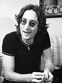 A black and white picture of John Lennon in his mid-thirties