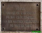 Plaque explicative apposée sur le monument des Serruriers.