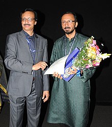 Rajendra Talak (right) being felicitated at IFFI-2011