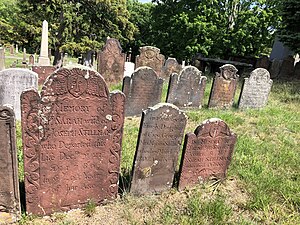 Overlooking a number of brownstone and schist markers