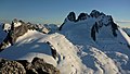 North aspect of Howser Spire (right) above Vowell Glacier viewed from Bugaboo Spire. (Pigeon Spire to left)