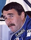 Nigel Mansell sporting a moustache with his eyes looking to the left