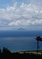 The island of Redonda as seen from Nevis, with Montserrat faintly visible in the distance