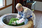 A bhikkhuni roasting tea leaves in Daejeon, Korea