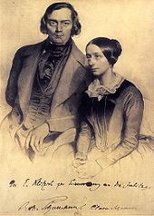 Signed engraving of middle-aged white couple seated and looking towards the camera. The man is clean-shaven; the woman's dark hair is tied in a bun