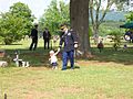 U.S. Army Soldier walking with his daughter at a military funeral.