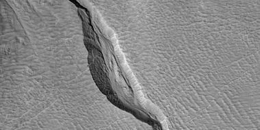 Close view of channel in gully showing streamlined forms, as seen by HiRISE under HiWish program