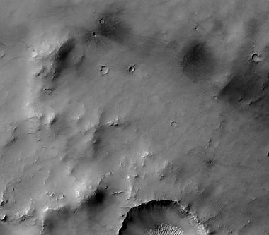 Dawes Crater floor with fresh impact craters, as seen by HiRISE. Click on image to see dark ejecta from some craters that formed when the impact reached a dark layer