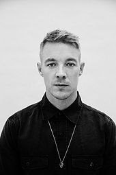 Greyscale image of Diplo looking to the camera.