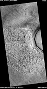 Wide view of fractured surface and pits along wall of crater, as seen by HiRISE under HiWish program