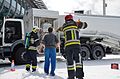 Pompiers de l'aéroport de Bruxelles en tenue de feu.