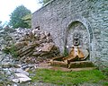 Ruins and surviving wall