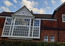 Joseph Nash Jr.'s studio with 1879 cartouche, Blenheim Road, on Norman Shaw corner house