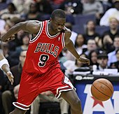 Luol Deng chasing after a loose ball