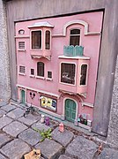 Miniature model of a pink apartment building