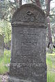 Tzedakah box on Jewish gravestone. Jewish cemetery in Otwock.