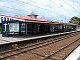 Platform 1, used by Down trains (to Wellington). The main station building is on this platform, housing the ticket office and passenger amenities. Access to Hutt Road and the bus terminal is also from this platform.