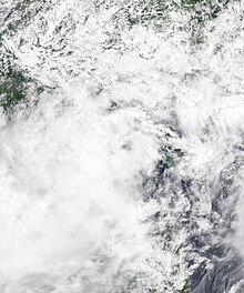 Satellite image of Sinlaku at peak intensity on August 2. The system had an exposed center at the time before moving inland.