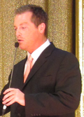 Photo of Todd Newton hosting the live-on-stage edition of the Price is Right at the Jubilee theater in Las Vegas, 2010.