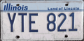Illinois license plate design used throughout the 1980s and 1990s, displaying the Land of Lincoln slogan that has been featured on the state's plates since 1954