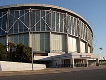 An arena is situated behind a road.