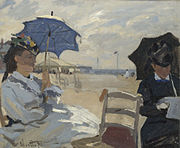 La plage de Trouville, 1870, National Gallery, London. The left figure may be Camille, on the right possibly the wife of Eugène Boudin, whose beach scenes influenced Monet.[60]