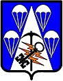 Special Troops Battalion, 4th Brigade Combat Team, USA: Azure, on a pile reversed between four parachutes deployed in pile reversed, argent, a pick axe paleways, head upwards, sable, surmounted by two lightning bolts in bend, tenny, surmounted by a double warded key in bend sinister, wards to base sable.