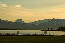 A lake with high mountains beyond