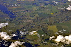 Aerial view, from the south, of Craven and vicinity (2013). Craven is just left of centre; Lumsden is obscured by clouds at lower left. Last Mountain Lake is at upper left.