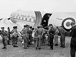 Former prisoners of war board a Dakota of No. 36 Squadron in Seoul, South Korea, August 1953