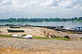 Different means of water transportation such as canoes and speed boat displayed at the sloping point bar of Oguta Lake.