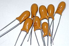 Dipped laquered tantalum “pearl” capacitors