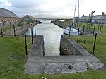 Dock, perimeter wall and attached buildings to east of Fort Belan